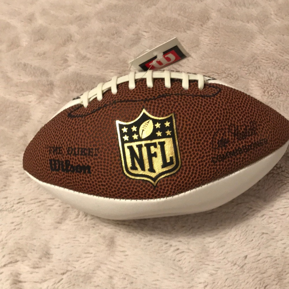 Jim mora signed NFL football